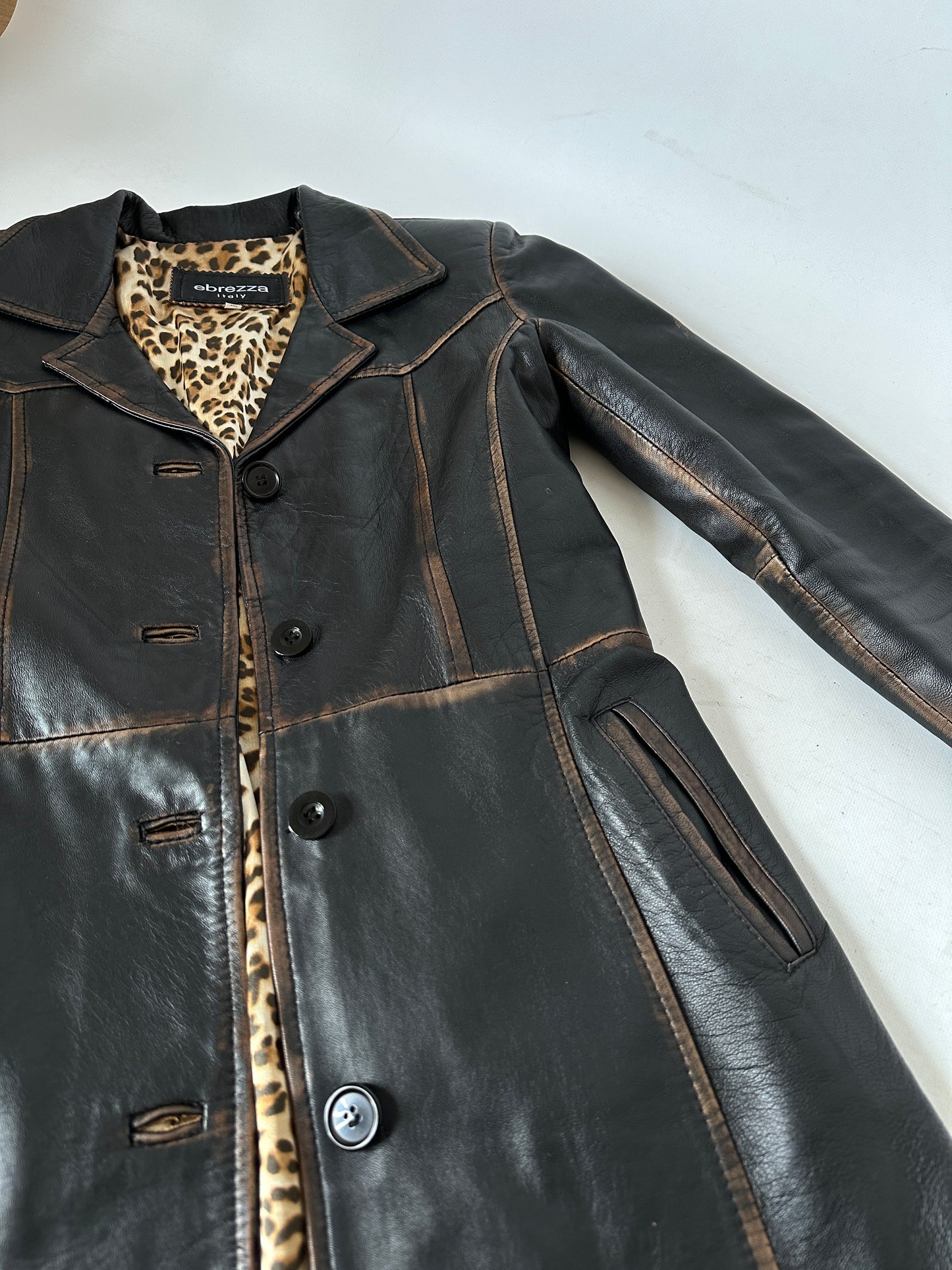 Distressed black leather trench