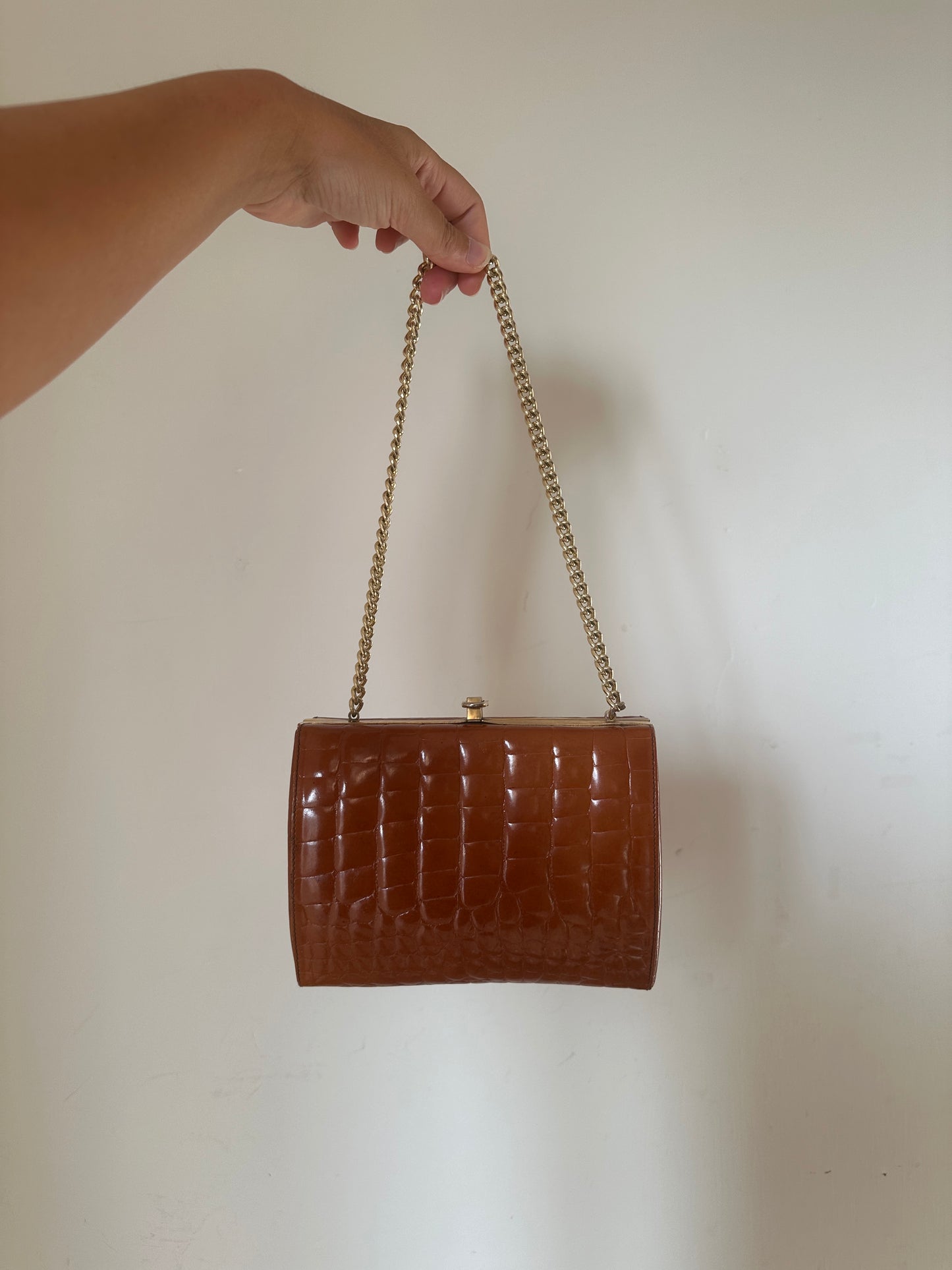 Caramel croco leather clutch