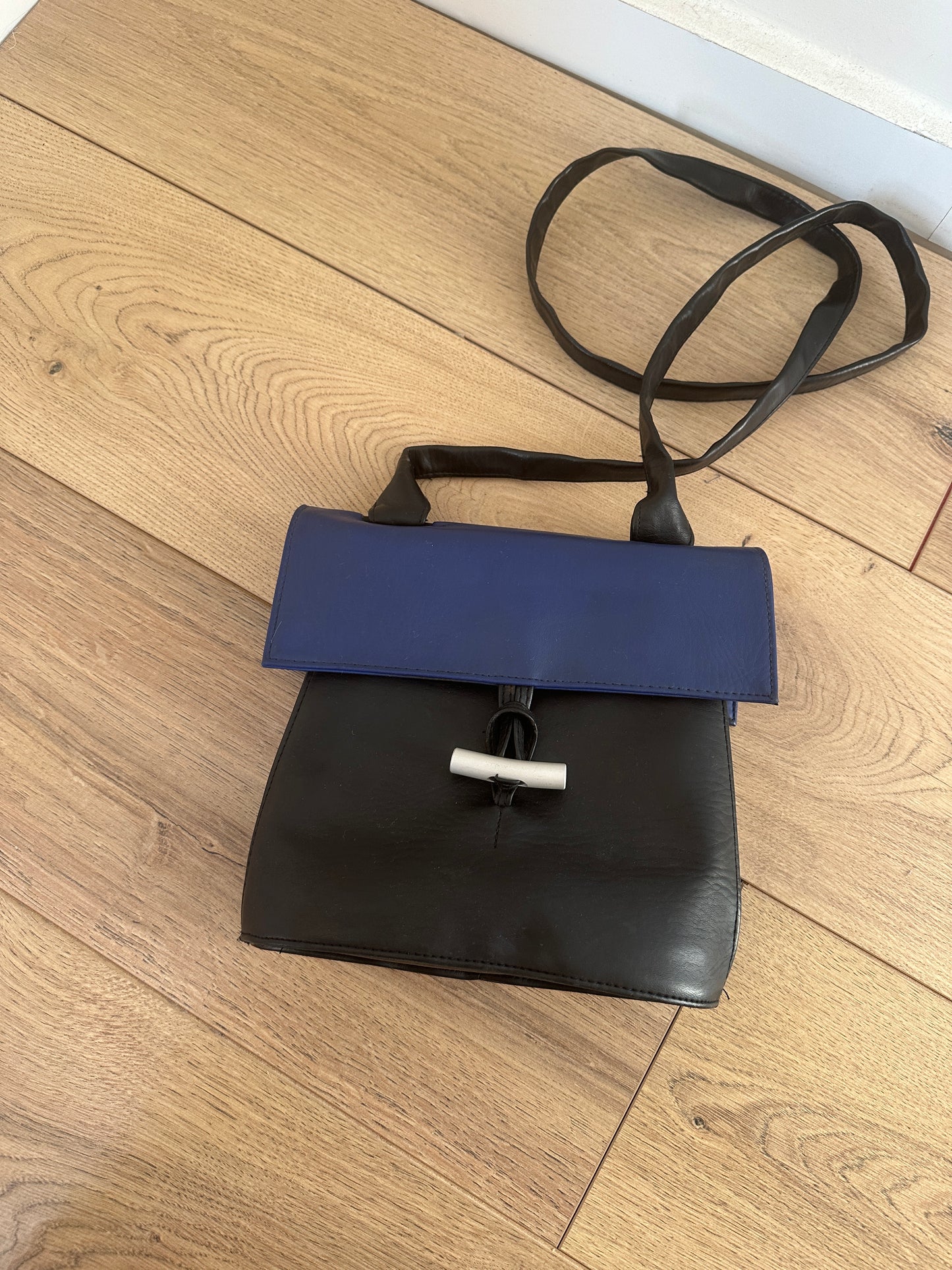 Black and blue leather bag